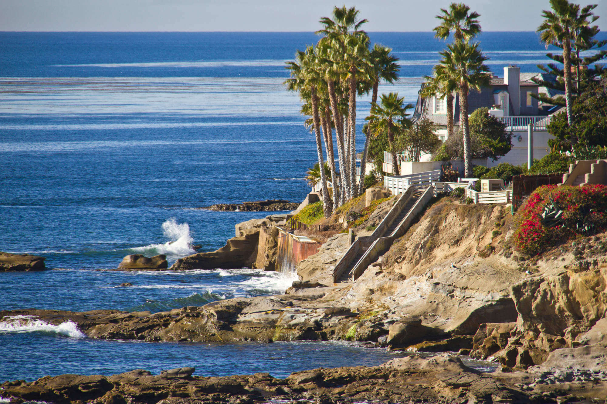 Cliffy shore and crashing waves in San Diego, California